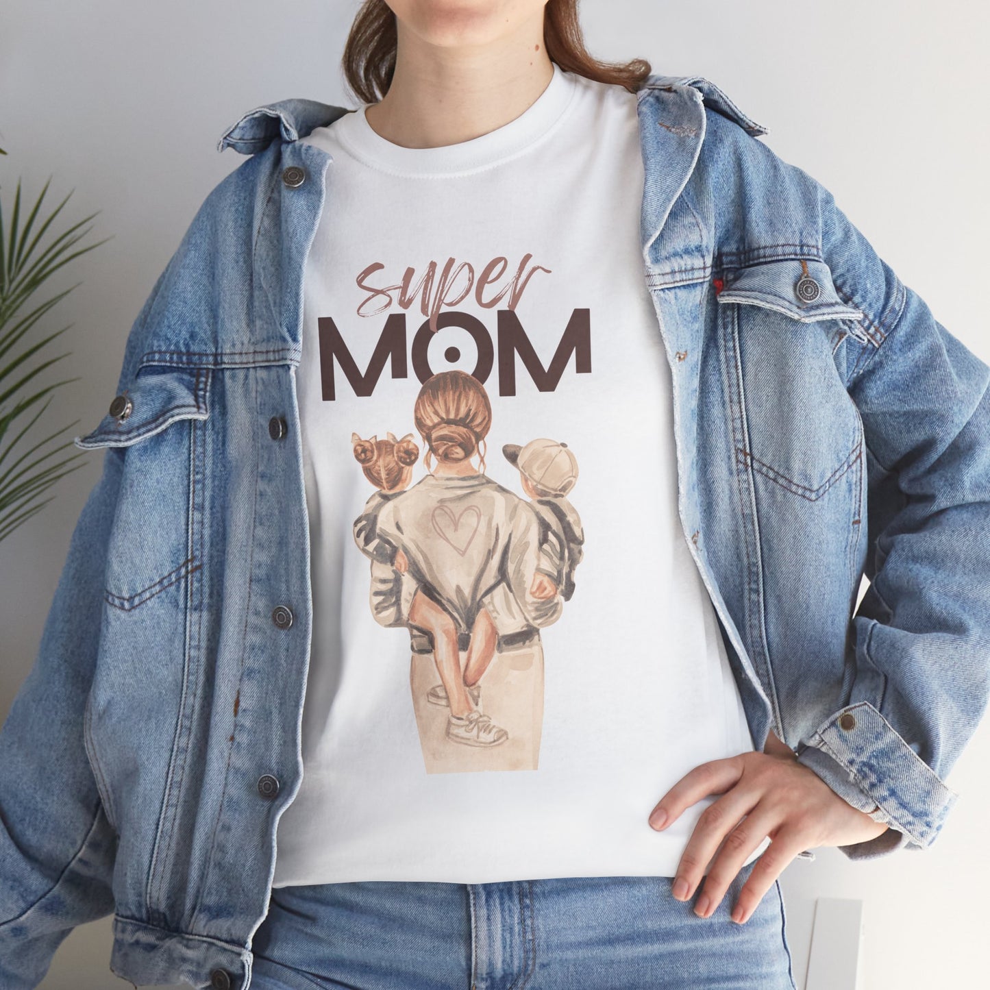 White celebration shirt for moms with super mom graphic and woman holding children in denim jacket